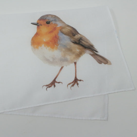 Folded white napkin with a robin bird print on a white background pocket squre cotton hankie handkerchief