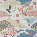 Japanese-style patterned fabric cotton handkerchief featuring a flying white crane, pink cherry blossoms, blue and beige waves, and scalloped wave motifs on a cream background.